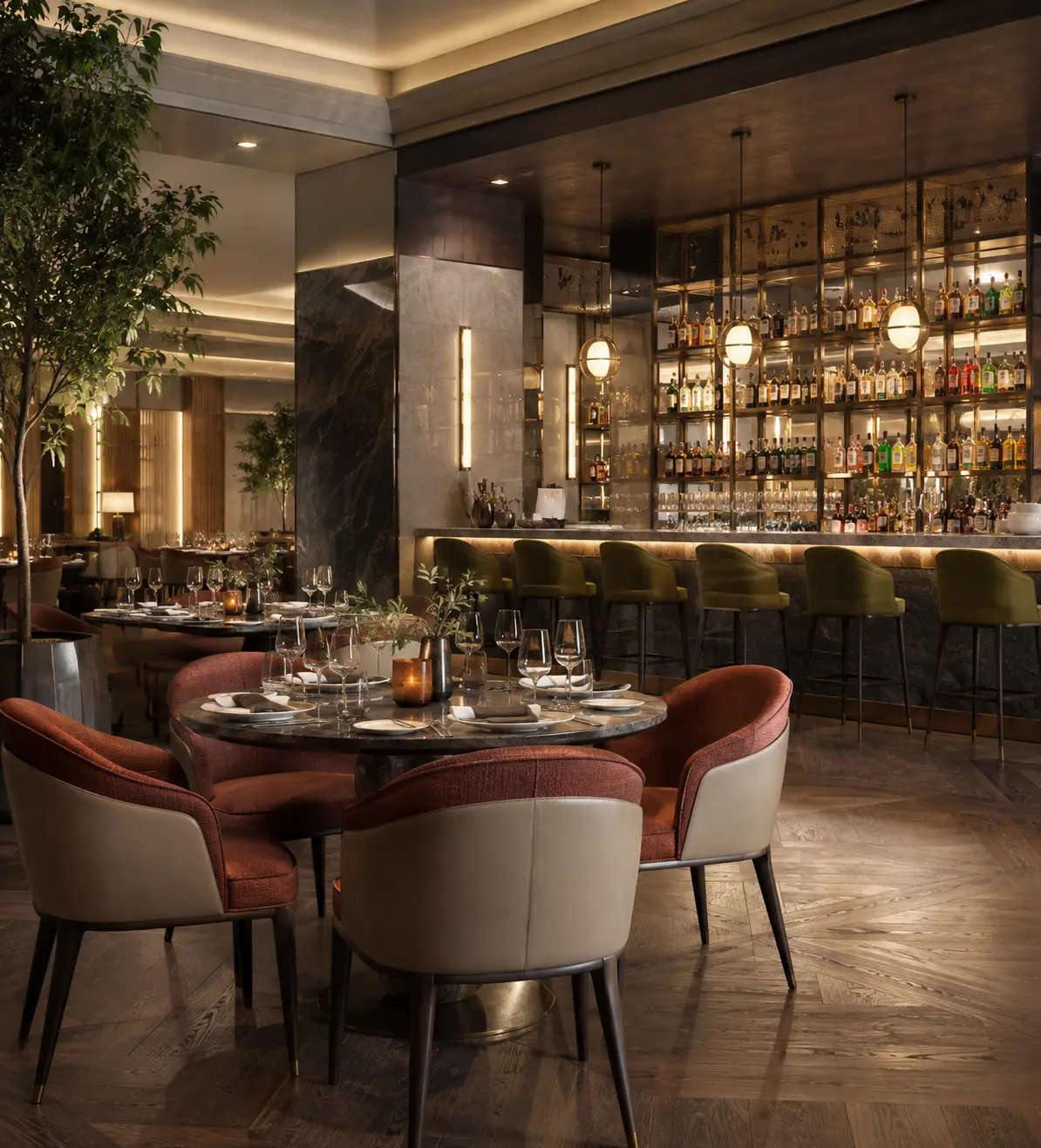 Four beige upholstered dining chairs with curved backs and dark wood legs around a dark wood rectangular dining table, set with white plates, wine glasses and greenery centerpiece, in a warm hotel restaurant with booth seating and marble columns.